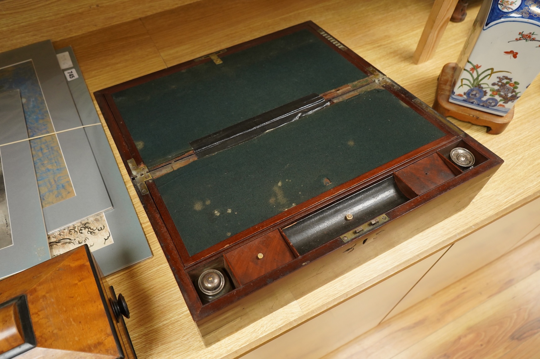 A bird’s-eye maple tea caddy and a brass mounted writing slope, latter 50cm wide